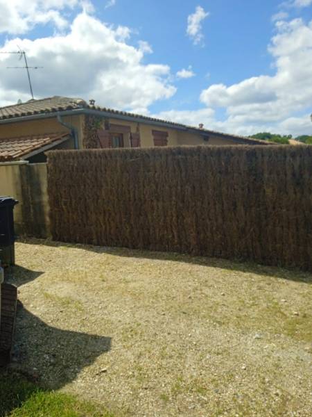 Création de clôture en panneaux de brande 8cm par un artisan spécialisé vers Parempuyre